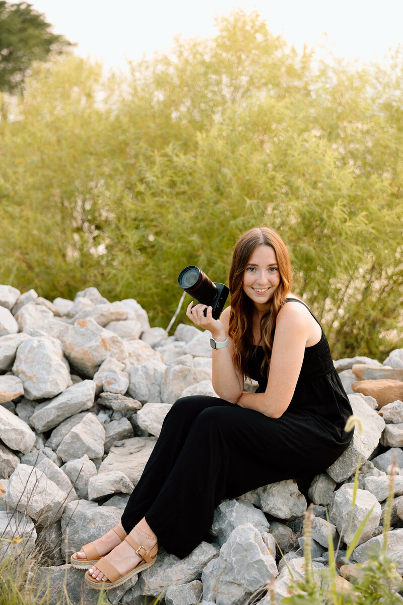 emalee kay poses for brand photos with her camera