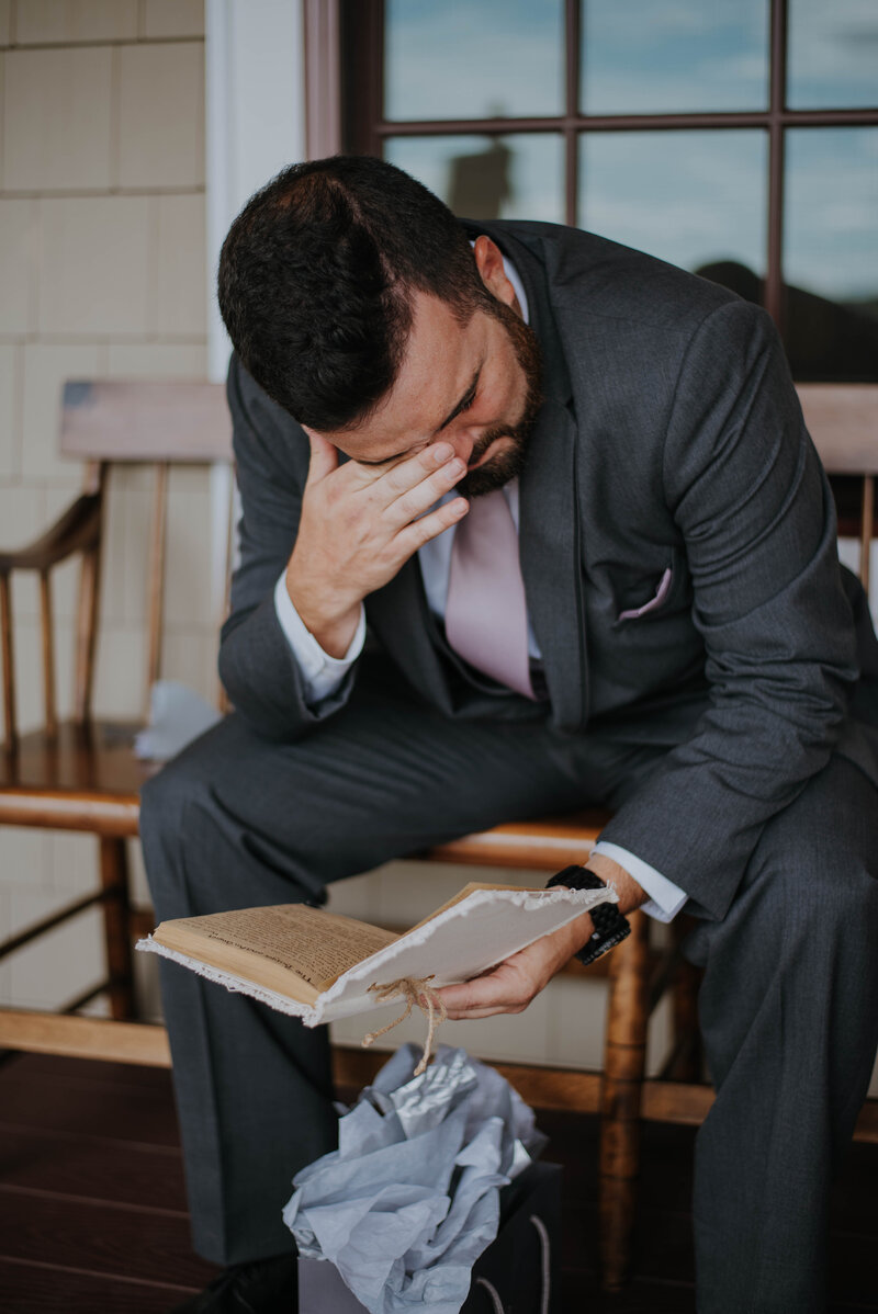 emotional moment for groom reading letter from bride