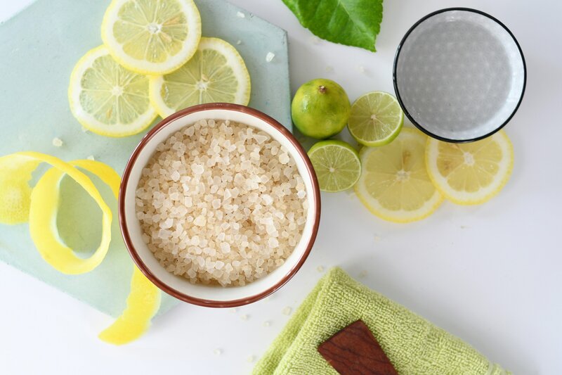 Flay lay of lemons, limes, and a bowl of salt