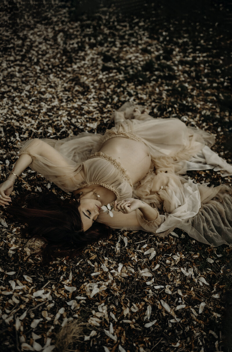 maternity-photography-lehigh-valley-pennsylvania- capturing mother laying on ground with baby bump