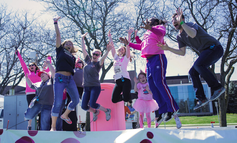 Outdoor stage performance by Chicago DJ and dancers at a spring corporate event