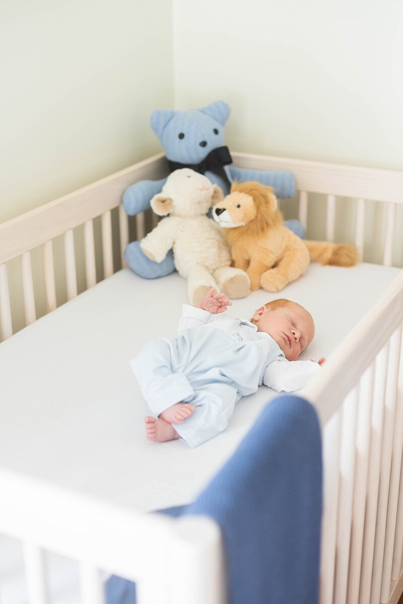 Baby in crib during in-home newborn session in Birmingham