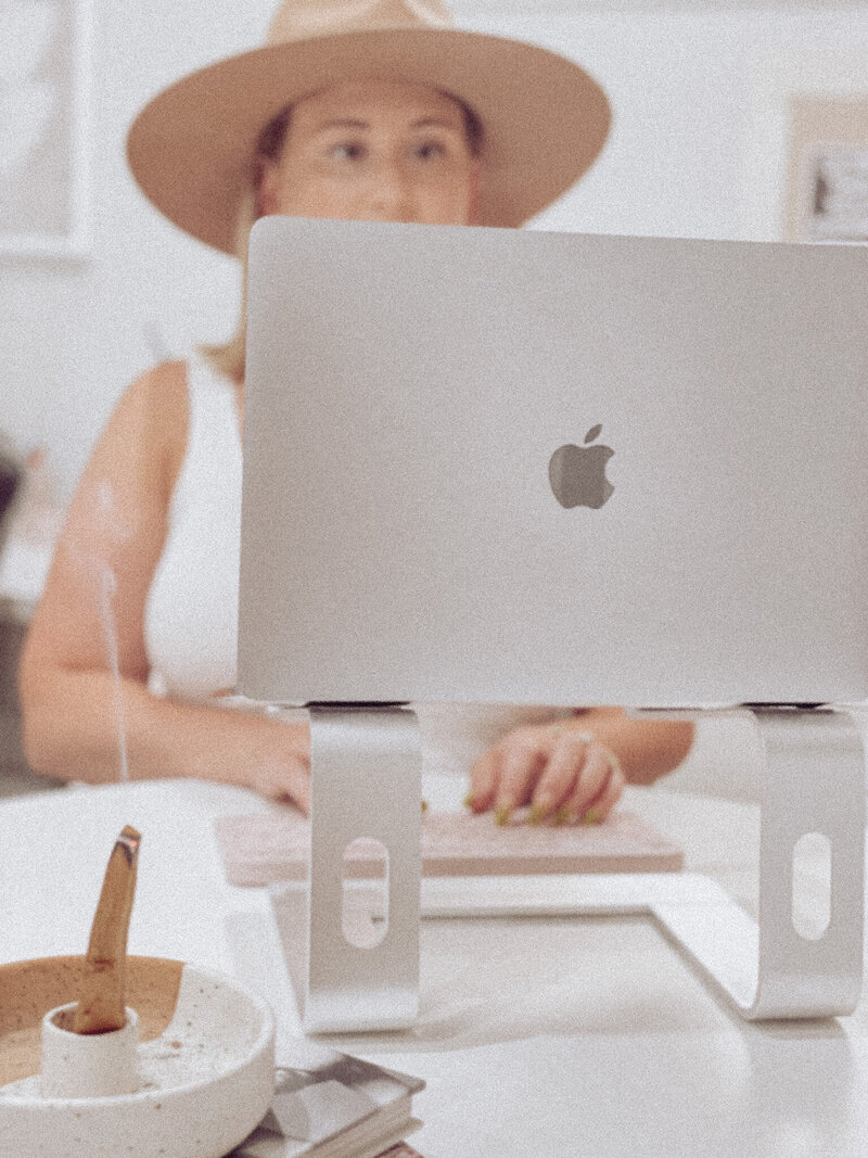 Photo of brand designer Kendra of Original Kreative with flat brim hat.