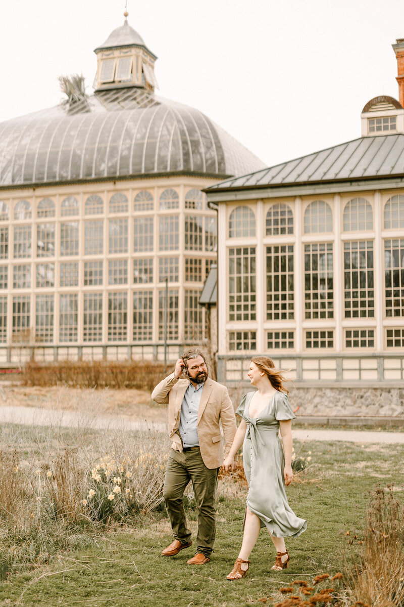 couple walking in grass