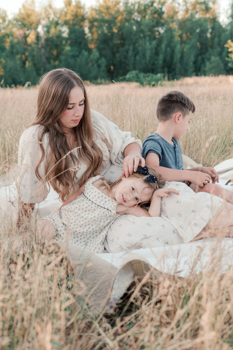A motherhood session in a field in Portland