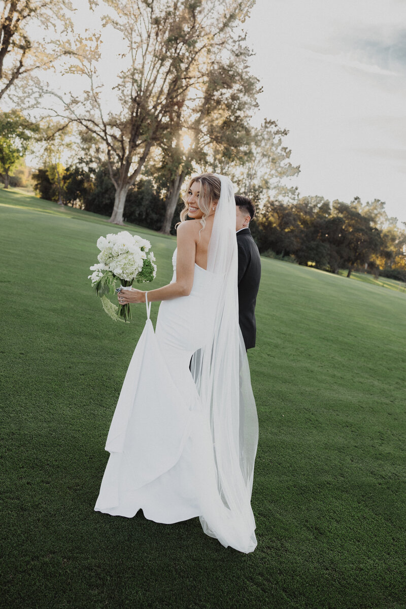 bride being walked down the aisle by her father