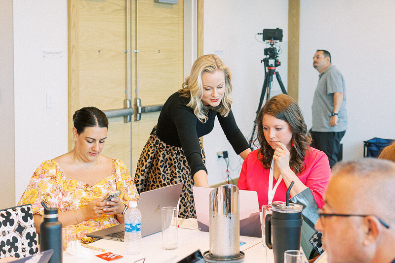 Sara Dunn working with WPCEO summit attendees