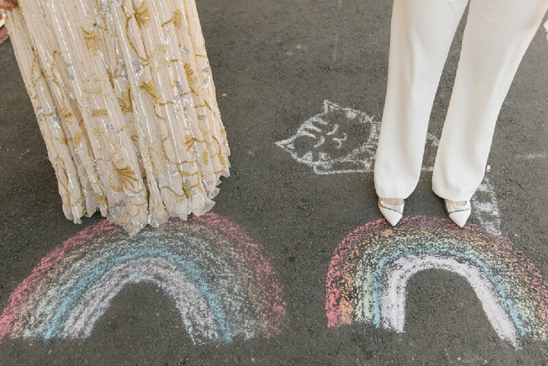 couple-in-front-of-chalk-rainbows