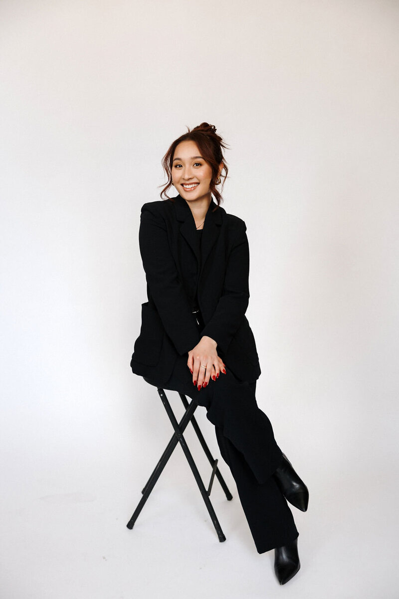 House of Virtua Mind's founder, poised in a white suit