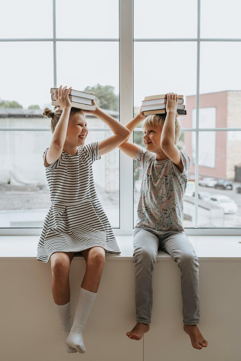  A small group of students engaging in interactive reading activities, fostering peer support and collaborative learning under the guidance of an experienced instructor.