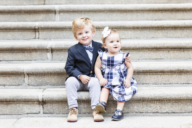 boy and girl sitting on stairs