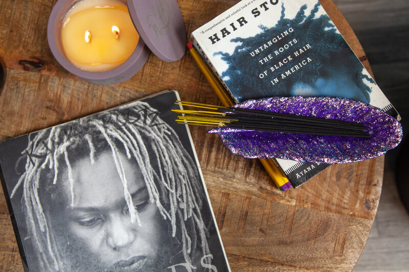 Image of Kink Rootz Salon with books on coffee table.