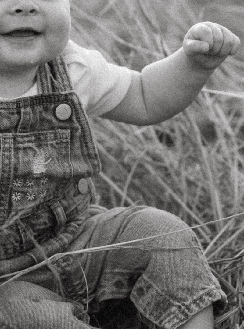 Candid photo of a baby girl celebrating her first milestone birthday, capturing the joy and innocence of her 1-year-old moment.