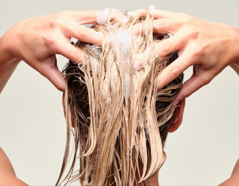 woman shampooing hair