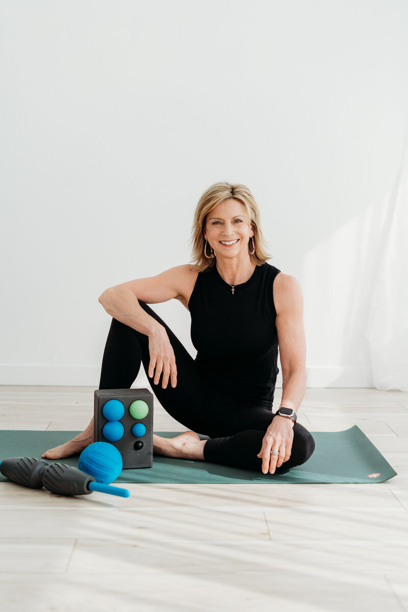 Sue Karthaiser sitting in her home studio