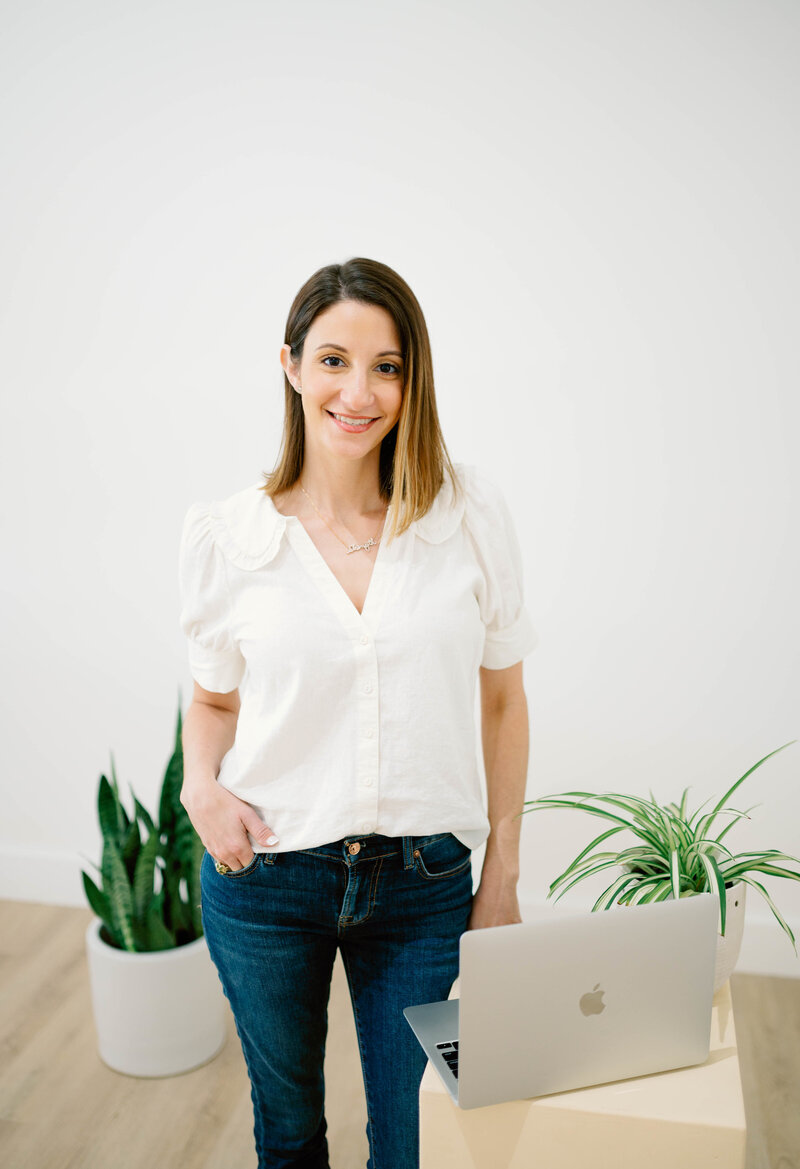 Women standing with computer