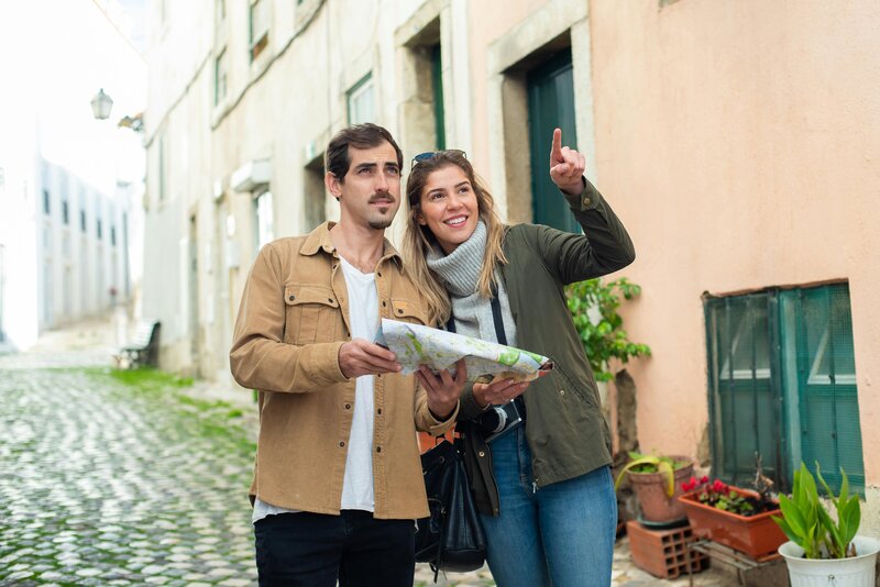 A couple walking on the street in Lisbon, Portugal.
