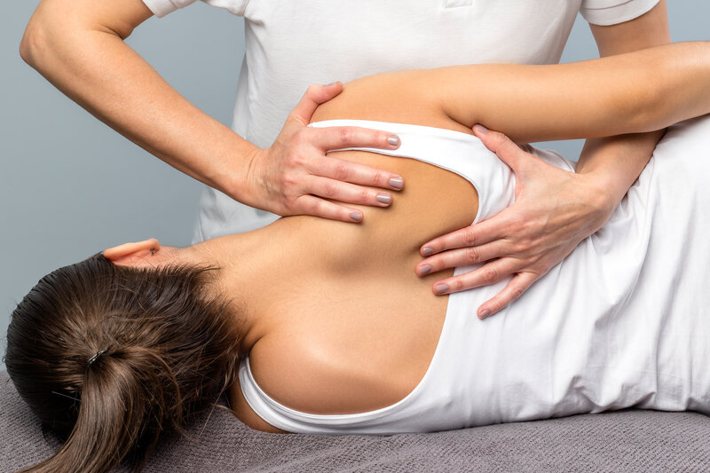 Manual therapy and stretching techniques applied to upper back and shoulder for chronic pain relief