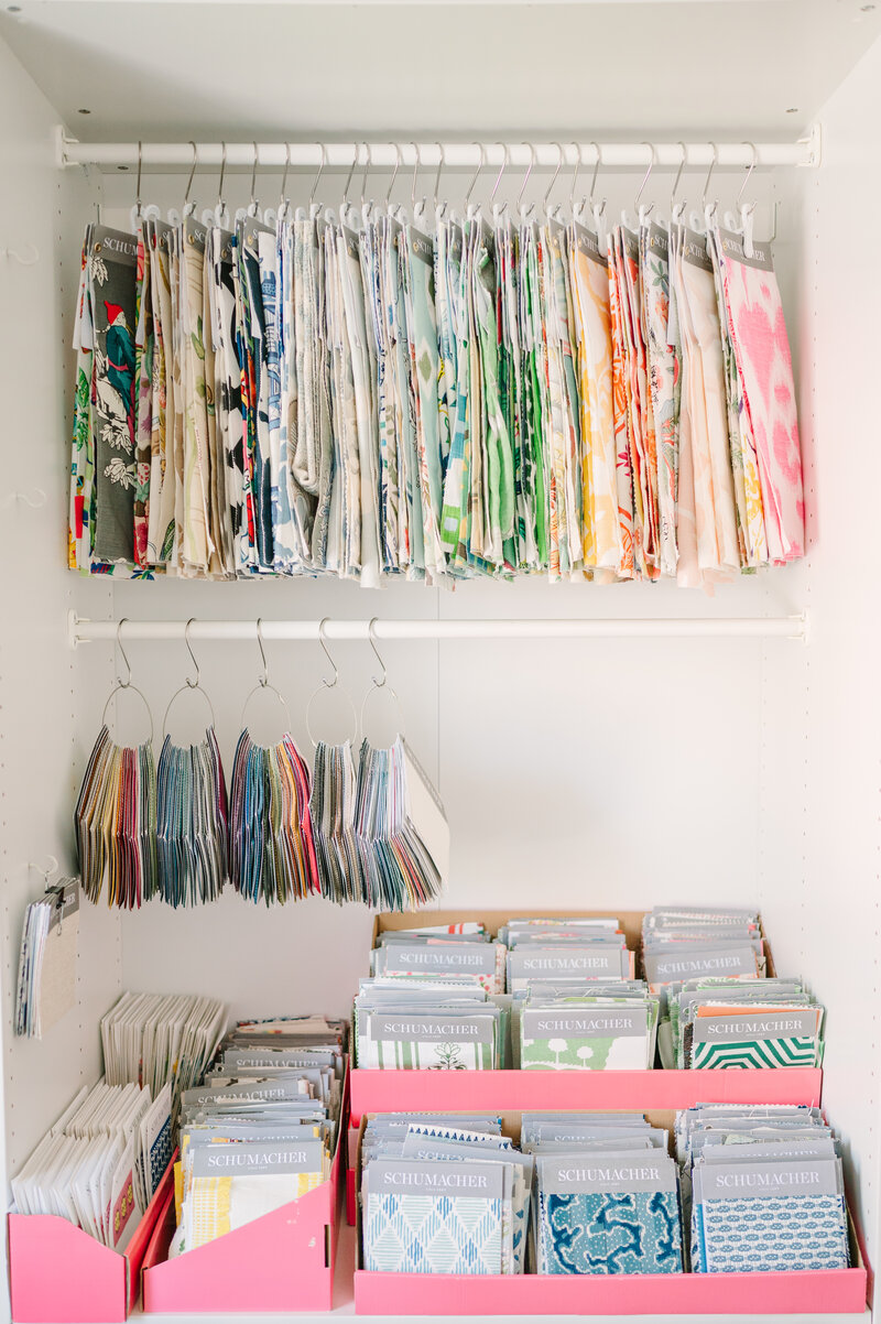 fabric swatches hanging in a clost