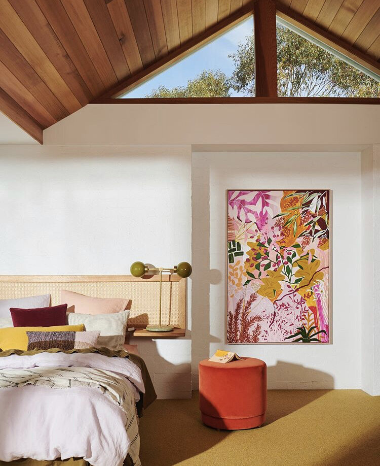 Artistic bedroom with bright colours styled by Melbourne interior decorator service for artist’s home.