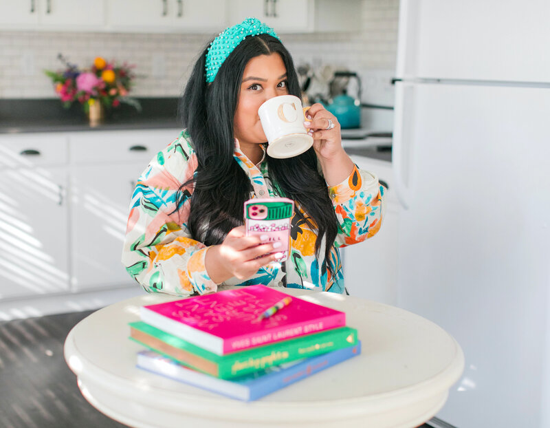 colorful woman sipping from a mug