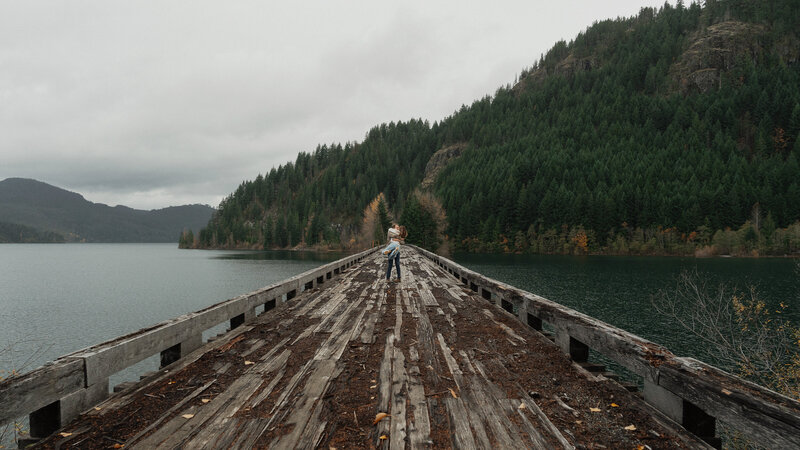 Couple on a trestle bridge in Campbell River during their engagement session by latitude 49 photography