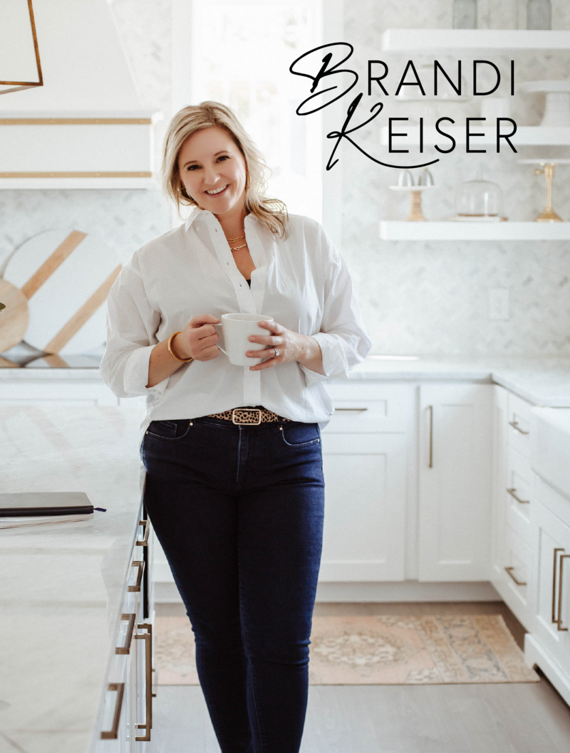 Typographic logo design on top of a bright branding photograph of a female entrepreneur