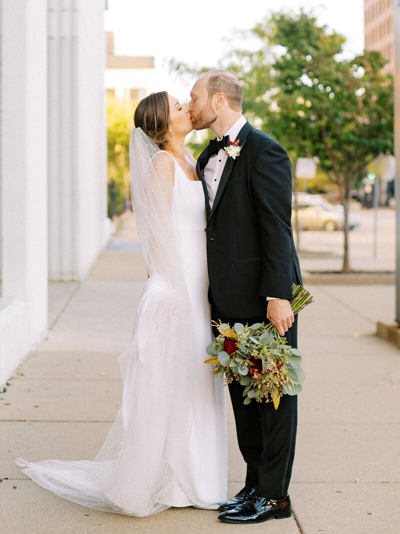 Bride and groom walk up memorial steps at their DC wedding