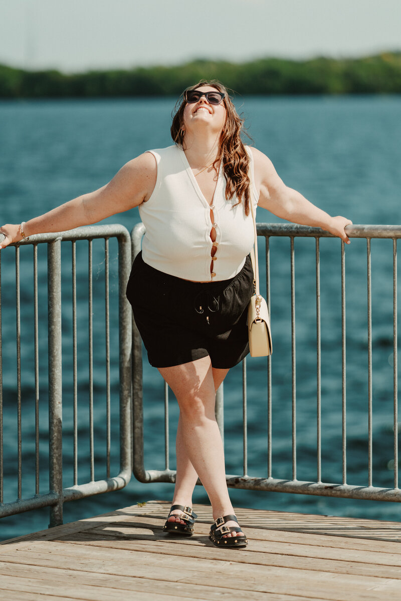 woman in sunglasses and a yellow dress with hat