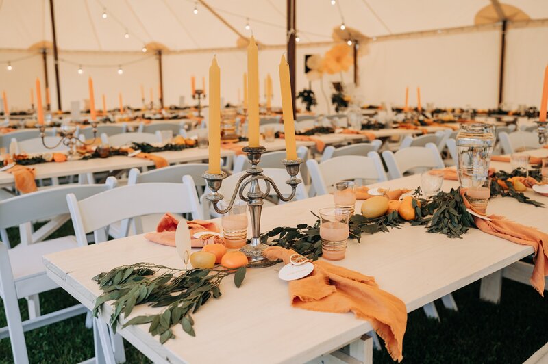 orange and yellow citrus themed wedding reception decor at farm chapel near waimumu gore