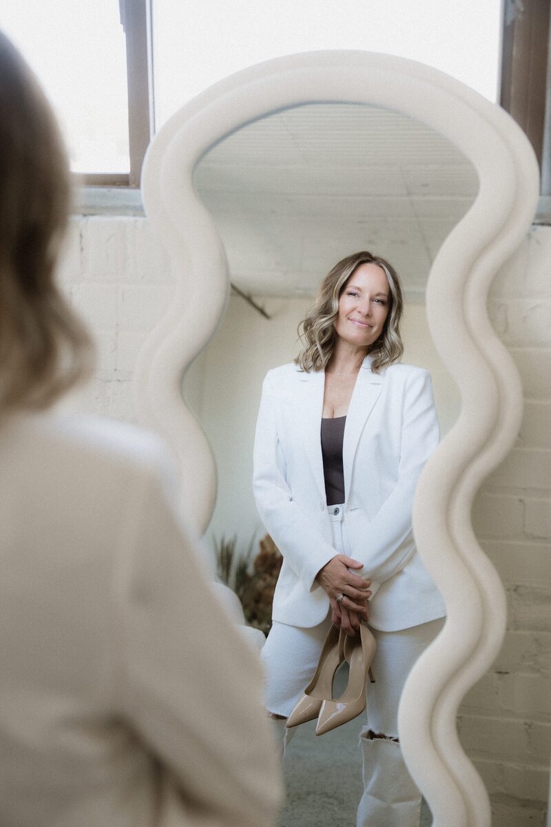 Confident woman embracing midlife transformation—Vanessa promotes self-love and empowerment during perimenopause and menopause