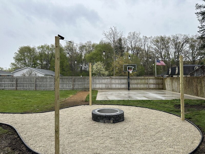 After: new backyard concrete slab and fire-pit area in Elkhart, IN