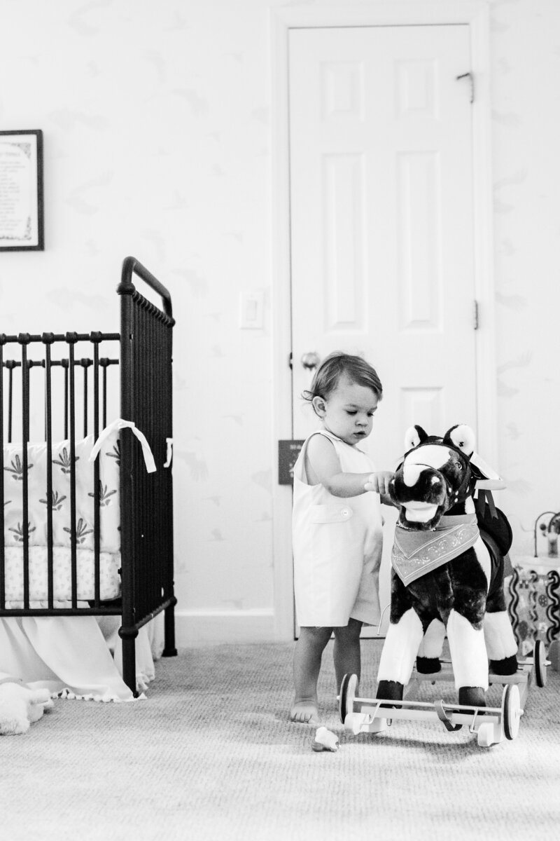 little boy with rocking horse