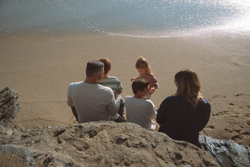 family of five at tablerock beach in laguna at golden hour