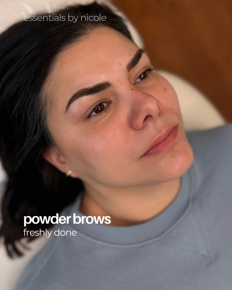 Close-up of soft permanent makeup powder brows on brunette client
