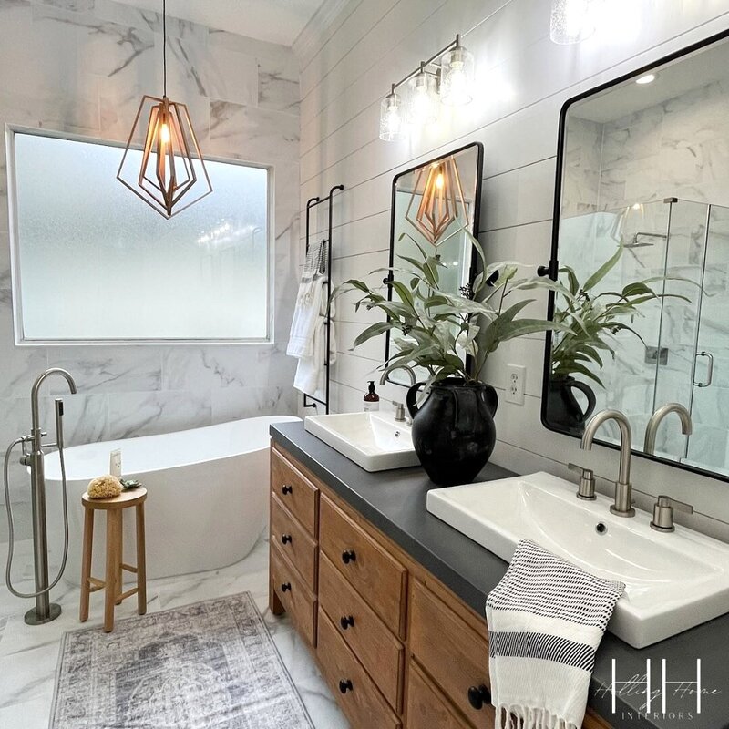 Spa-inspired bathroom featuring tilework, elegant fixtures, and cohesive finishes by Holling Home Interiors.