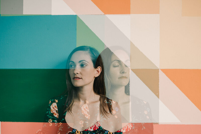A photo with the reflection of a person in two different poses. 