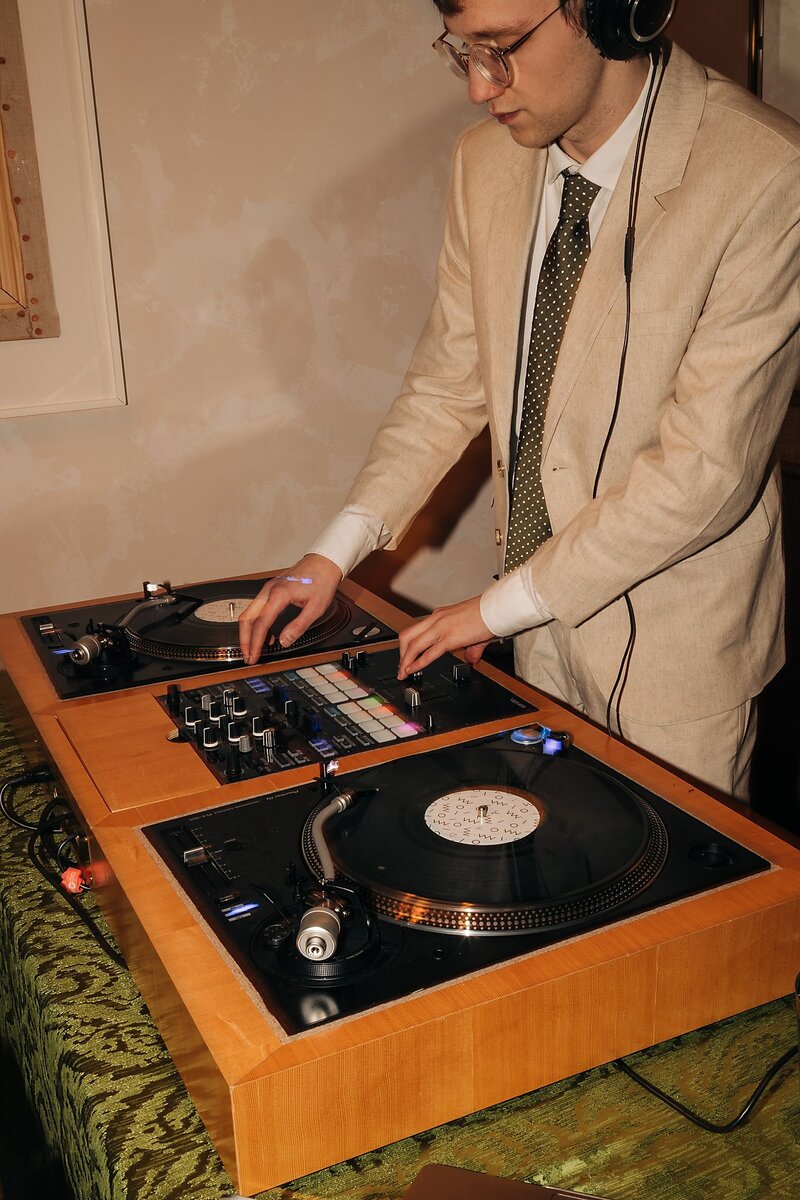 DJ performing at Dart Collective’s Chicago launch party at Lou Lou by Lola Cafe