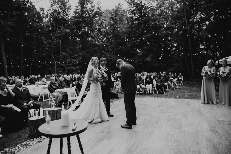Bride and groom standing up at their ceremony