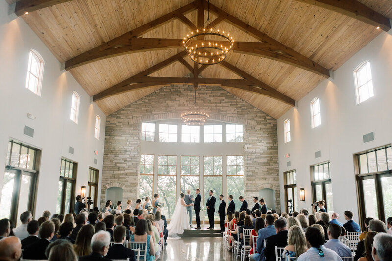 Indoor chapel ceremony at Canyonwood Ridge with modern architecture and soft light
