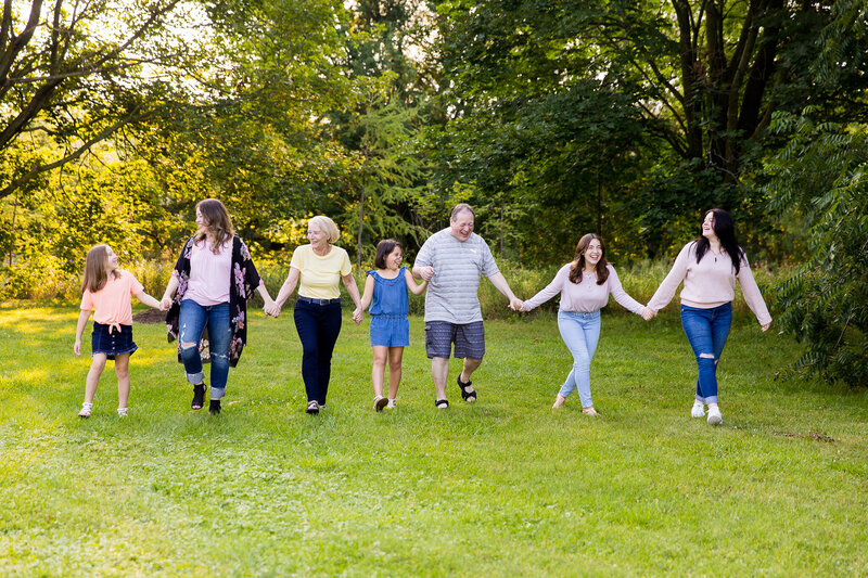 Mom with four kids and grandparents walking towards camera in Beeton Ontario