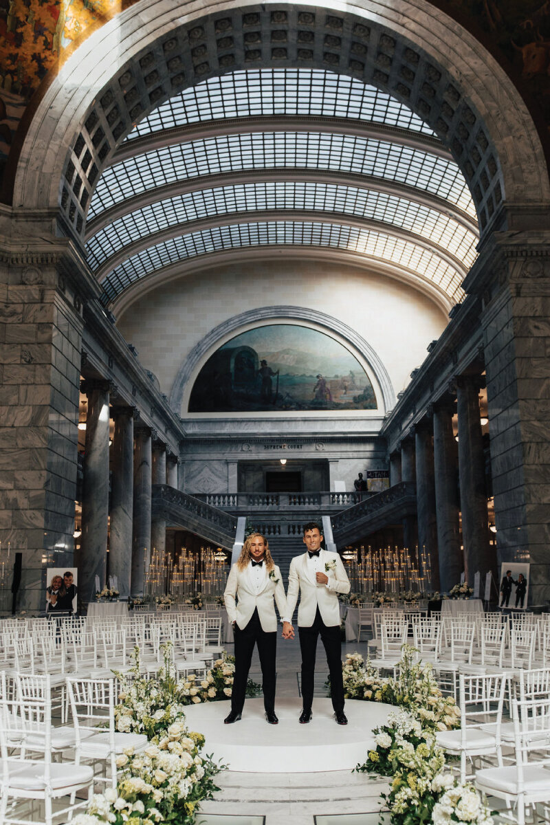 stylish-grooms-in-white-jackets-reception