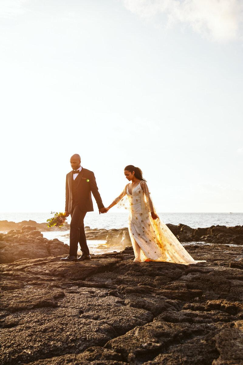 Bride and groom walking hand in hand - The Big Island, Hawaii