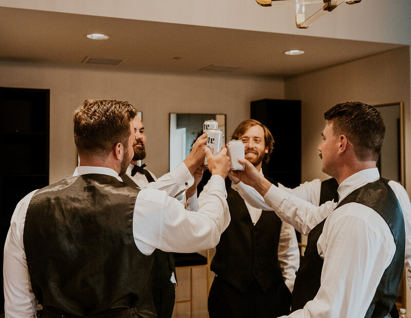 Groom with his groomsman cheering