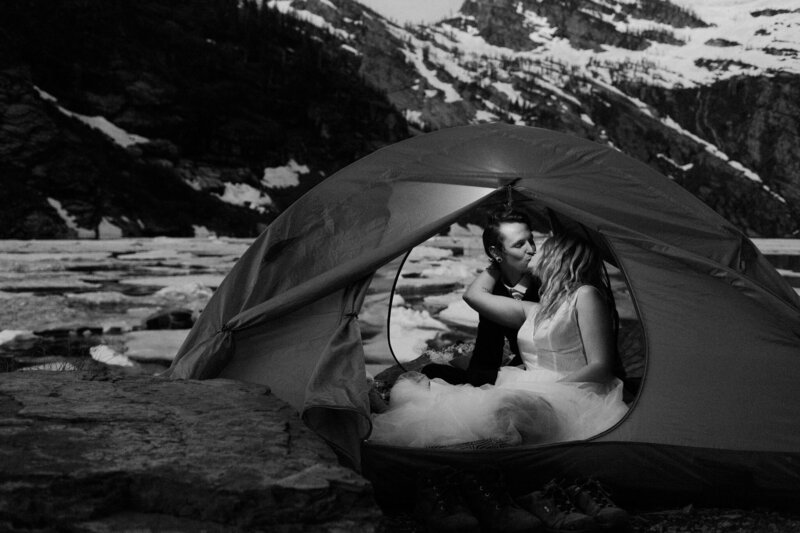 an image of us getting ready in our tent for our own elopement sharing a bit more about us and our day.