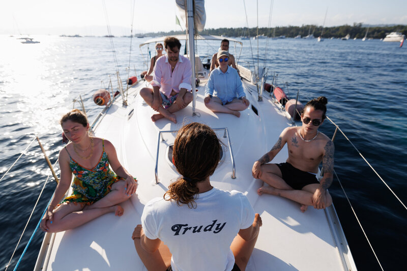 Yoga practitioners onboard a sailboat