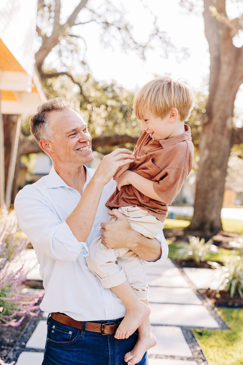 father holding his son during a Houston family photography session