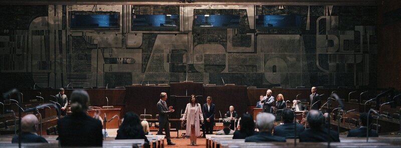 Dramatic interrogation scene from "Dangerous Truth – Das zweite Attentat," capturing suspense and intensity.