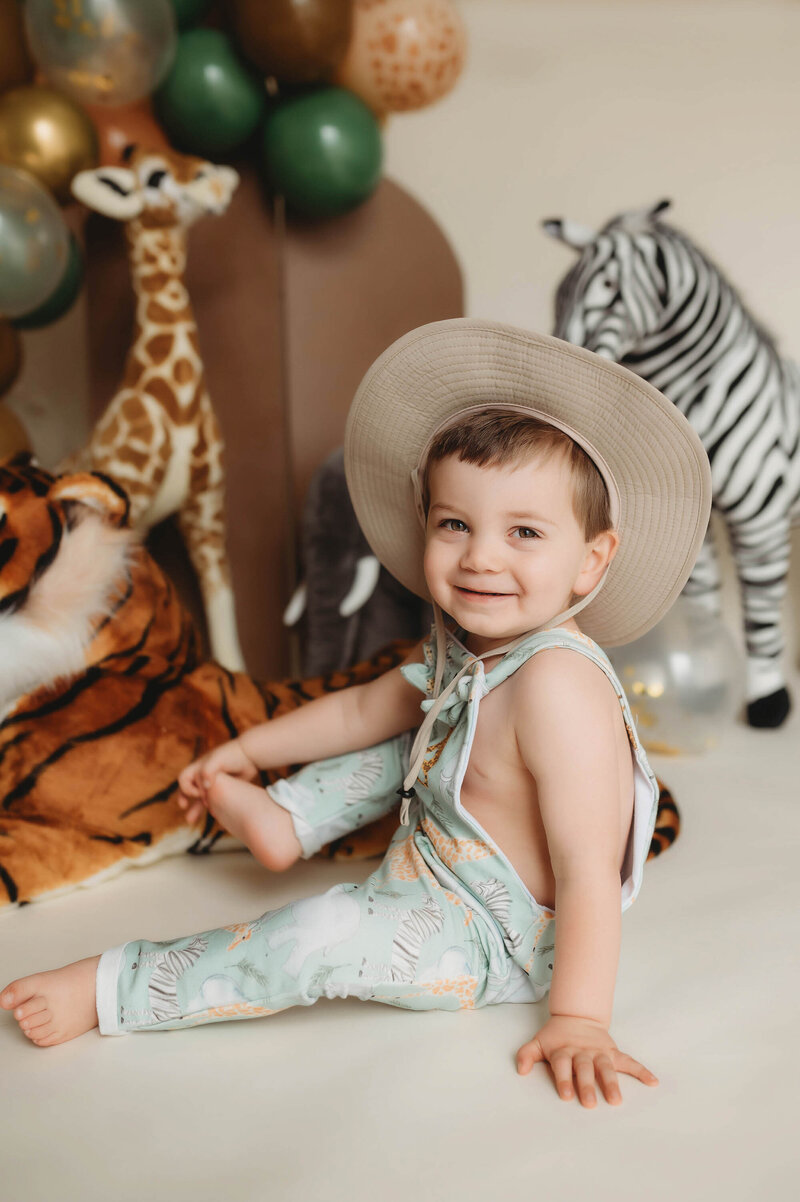 Baby smiles at the camera during his Birthday Photoshoot in Asheville, NC. 
