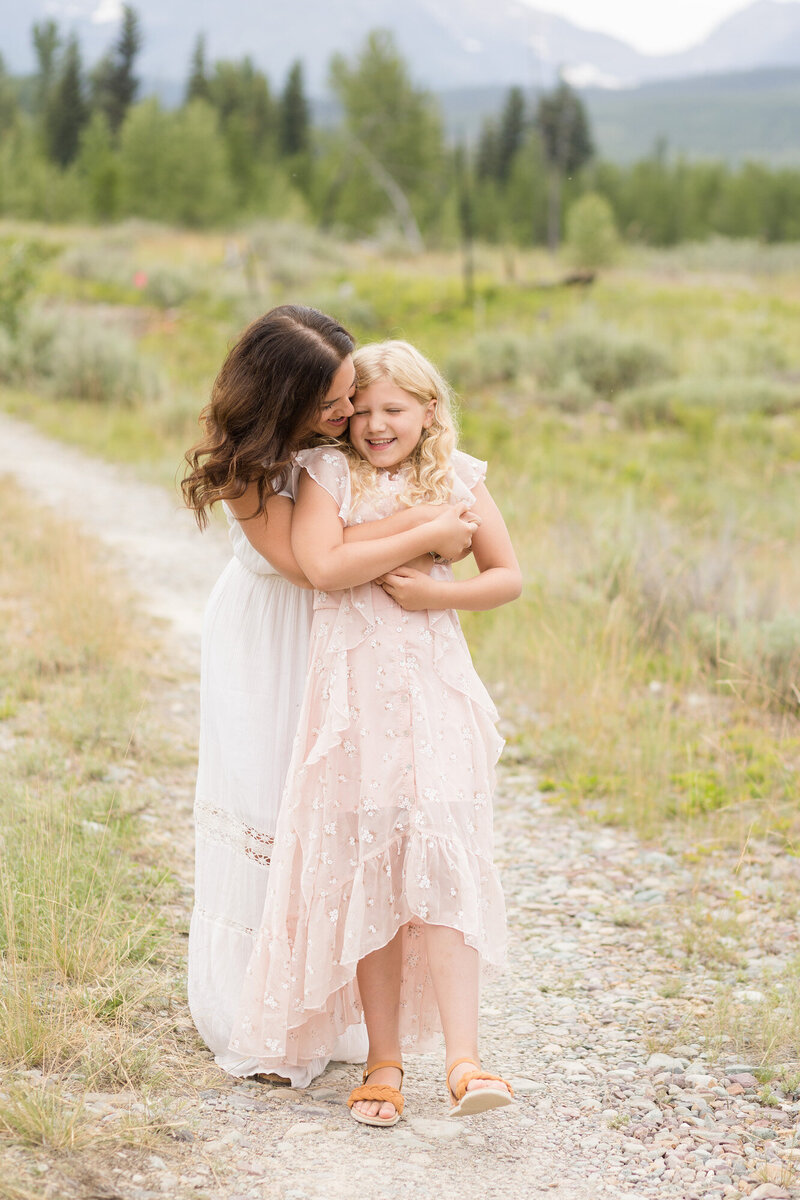 Christy huggin her daughter.